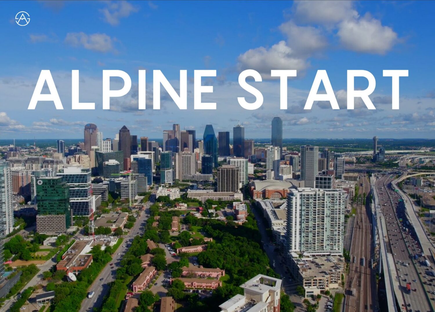 Aerial view of Dallas skyline with "ALPINE START" text overlay and company logo against blue sky with clouds.